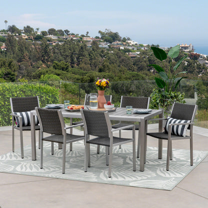 Coral Bay Outdoor 7 Piece Aluminum and Wicker Dining Set with Faux Wood Table Top