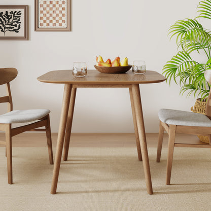 Evander Mid-Century Modern Faux Wood Dining Table with Tapered Splayed Legs for a Timeless Communal Focus