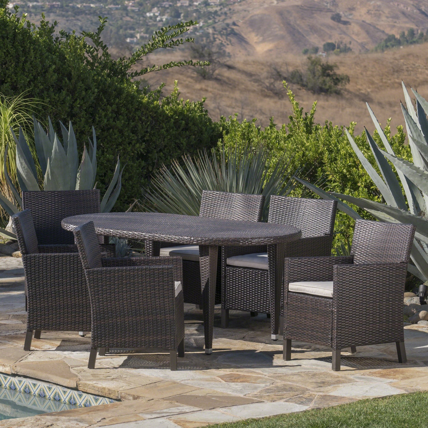 Crete Outdoor 7 Piece Wicker Oval Dining Set with Water Resistant Cushions